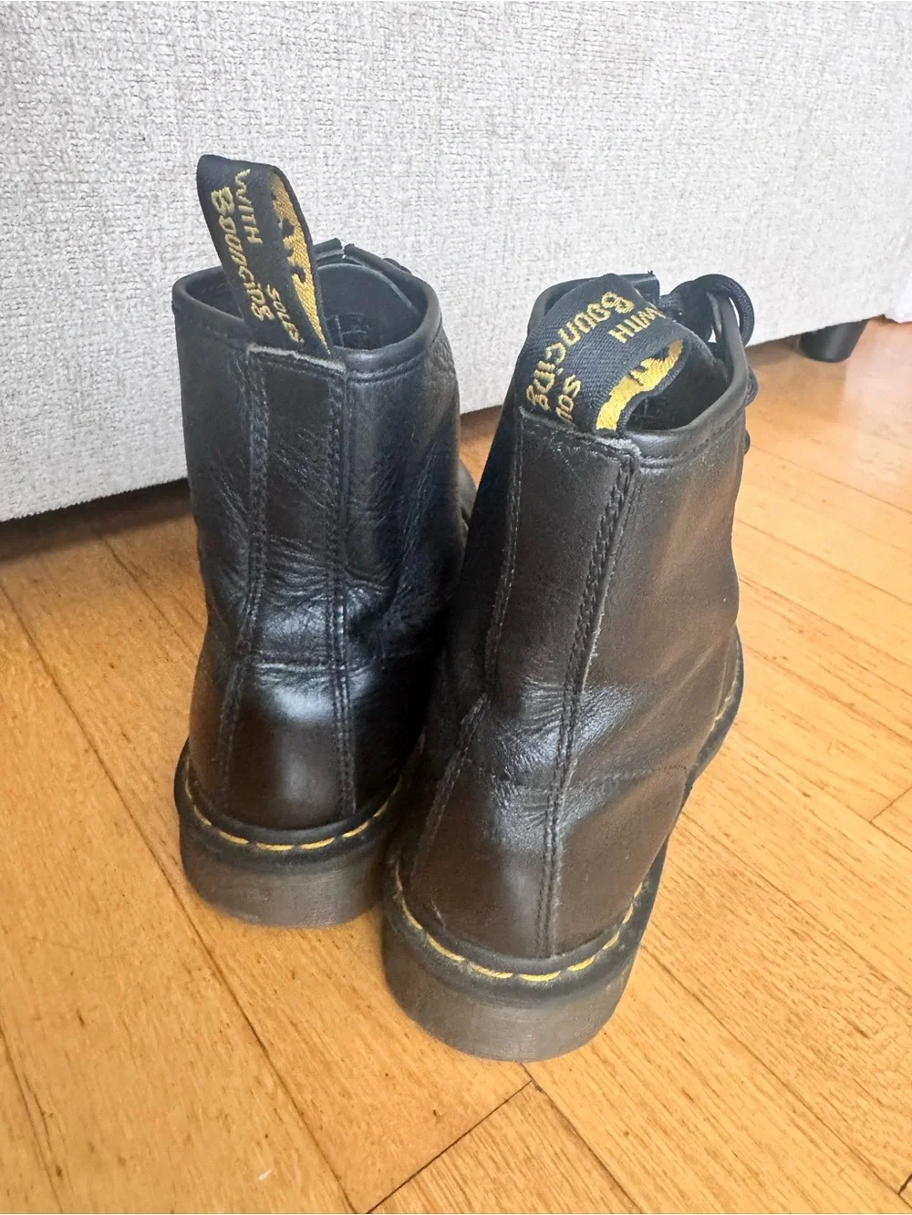 Dr. Martens Black Leather 8-Eye Lace-Up Ankle Boots with Yellow Stitching